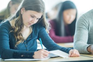 A student focuses on a test. Can student loans be discharged through bankruptcy is a question we hear often at our Downriver law firm.